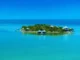 Aerial view of Cayo Espanto Belize private island resort surrounded by turquoise Caribbean waters