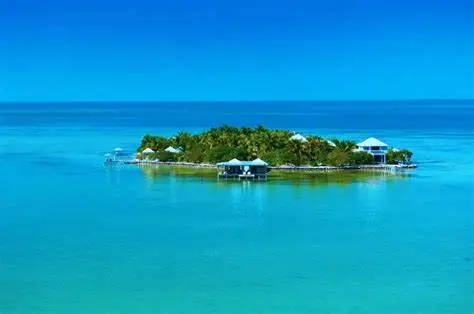 Cayo-espanto belize Aerial view of Cayo Espanto Belize private island resort surrounded by turquoise Caribbean waters