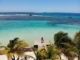 Aerial view of Belize Barrier Reef showing vibrant coral formations and turquoise Caribbean waters, symbolizing Belize’s world-class scuba diving sites.