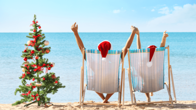 Christmas in Belize celebrated on a tropical beach with palm trees, sunshine, and festive decorations.